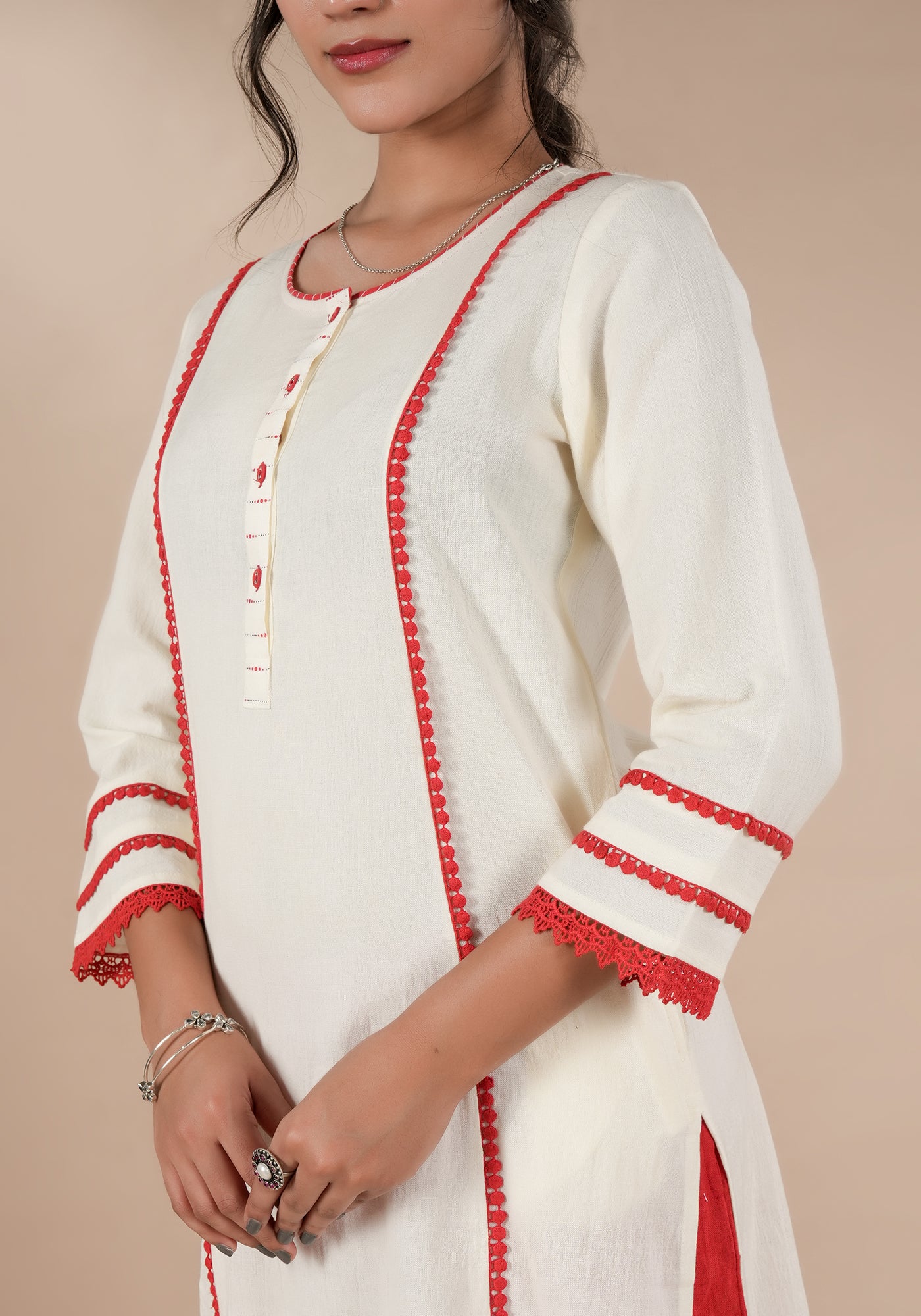 BINDU SOILD OFF WHITE KURTA WITH RED DETAILS