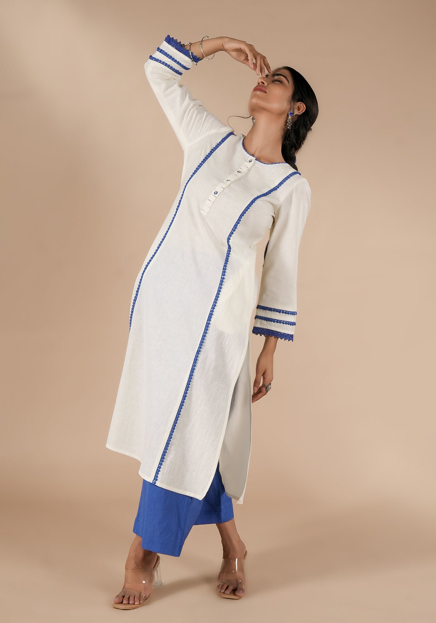 BINDU SOILD OFF WHITE KURTA WITH BLUE DETAILS